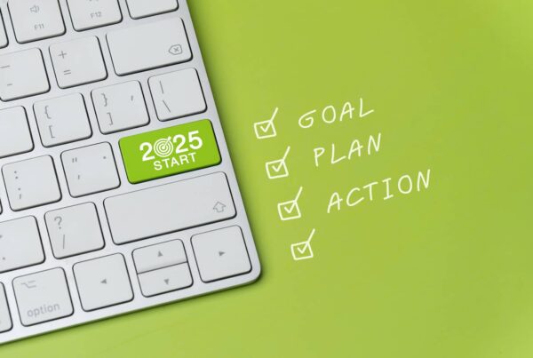 A keyboard with a "2025 Start" key next to a checklist with Goal, Plan, Action