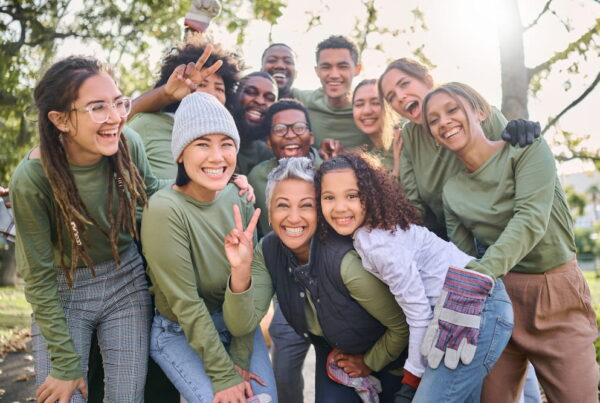 Group of volunteers posing and smiling